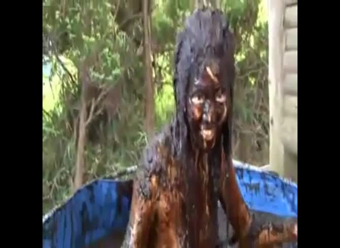 Video :Nasty girl diving in a bucket full of poop